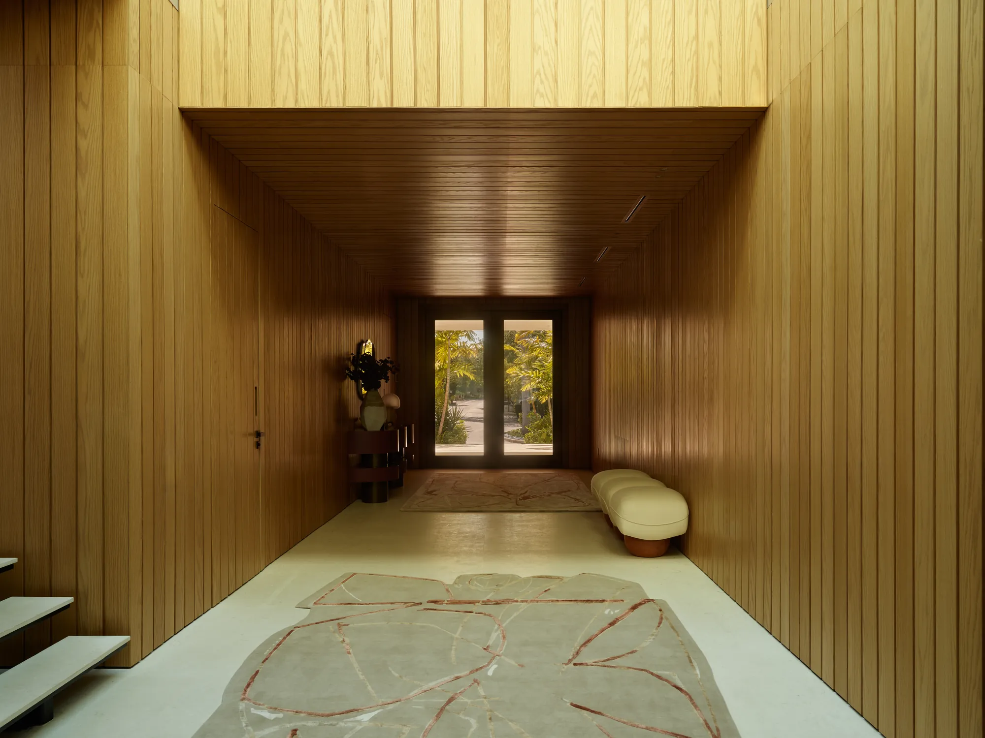 Seamless plaster surfaces and a skylit atrium in the Broadview residence by LUXOM