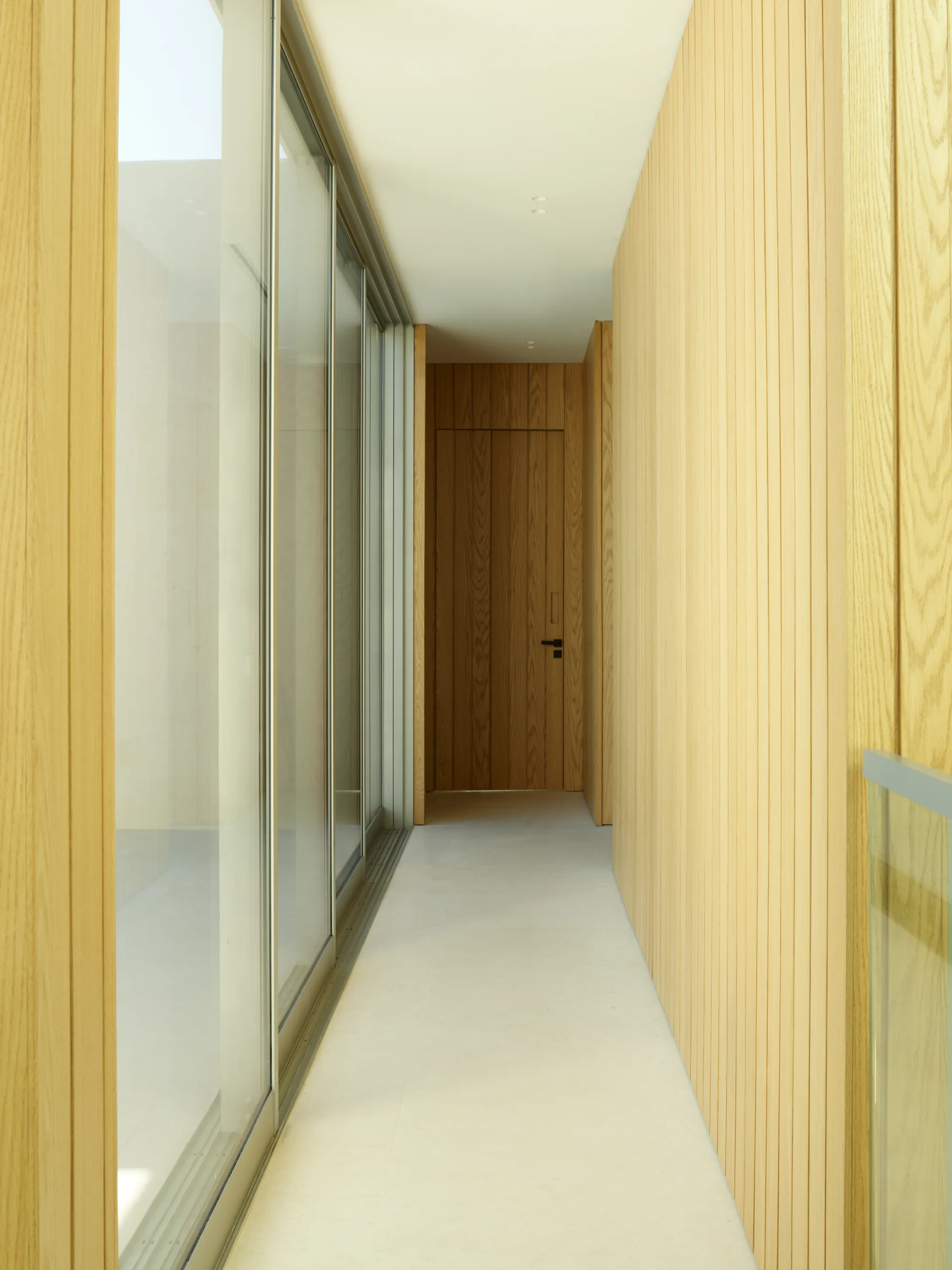 Intimate wood-lined interior in the Broadview residence by LUXOM, Miami