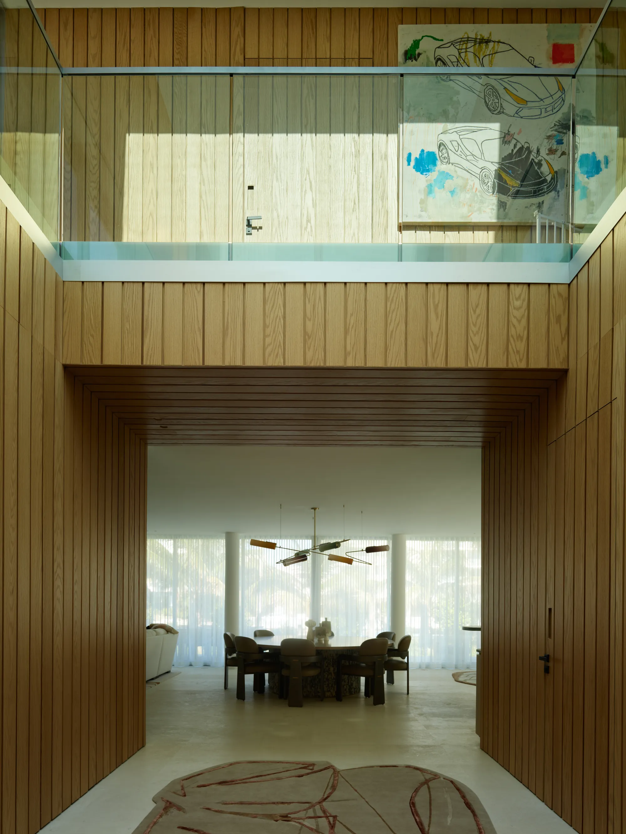 Hand-finished plaster and stone wall surfaces in the Broadview residence by LUXOM